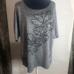 Women’s grey blouse with black beaded floral design.